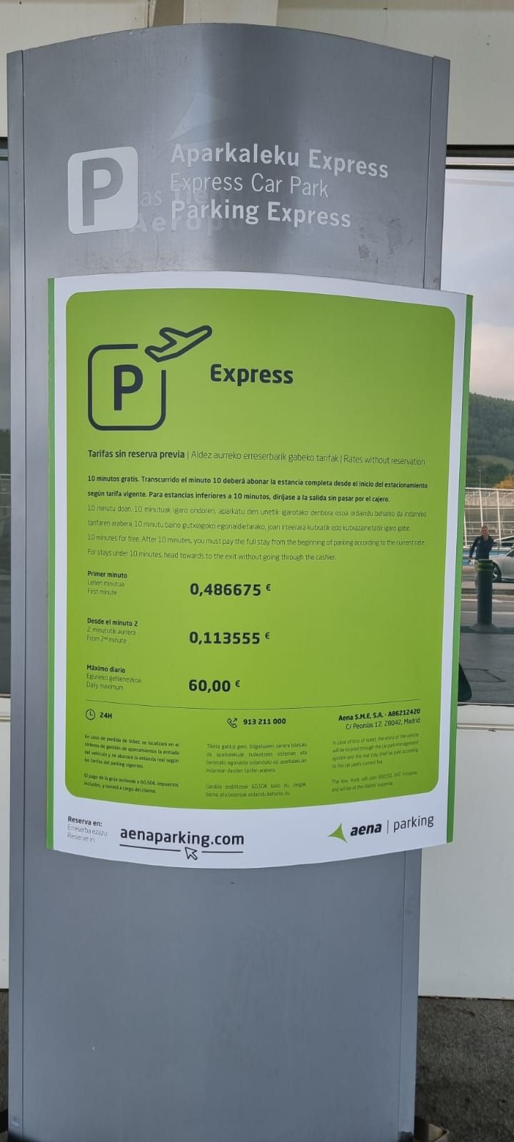 Picture of a car park information sign, presumably in the Basque Country, stating that the first minute costs €0.486675 and subsequent minutes €0.113555. Photo by Chris Sangwin.